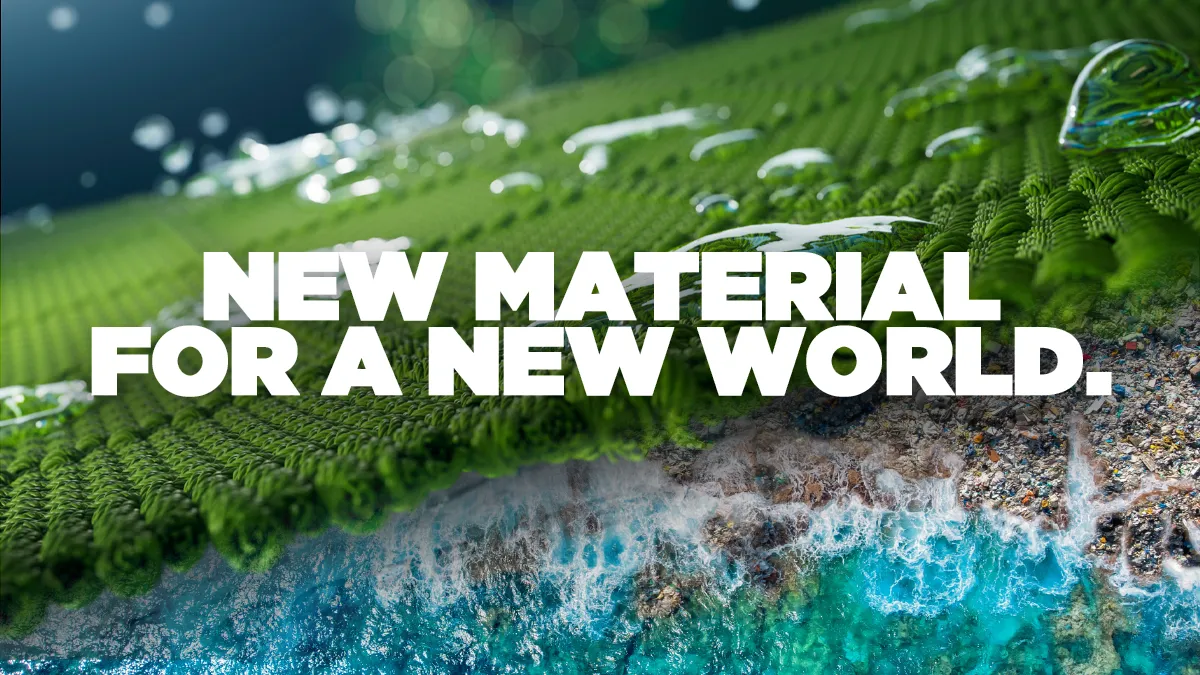 Green woven textile transitioning into a recovered-material coastline — “New Material for a New World”